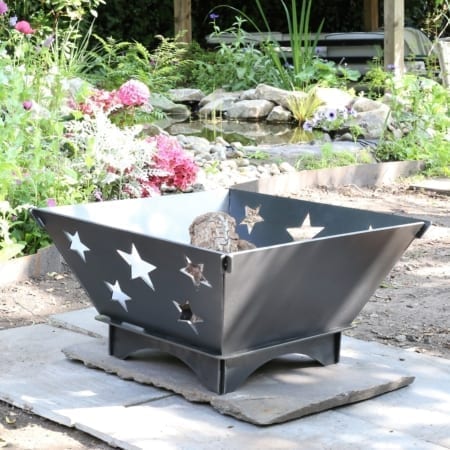Collapsible fire pit with star decoration.