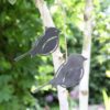 2 hanging metal robins