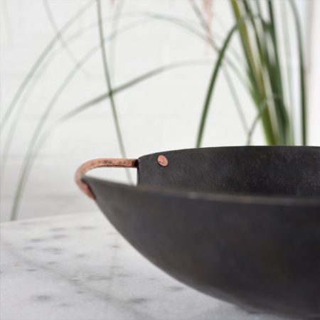 handmade metal bowl with copper handles